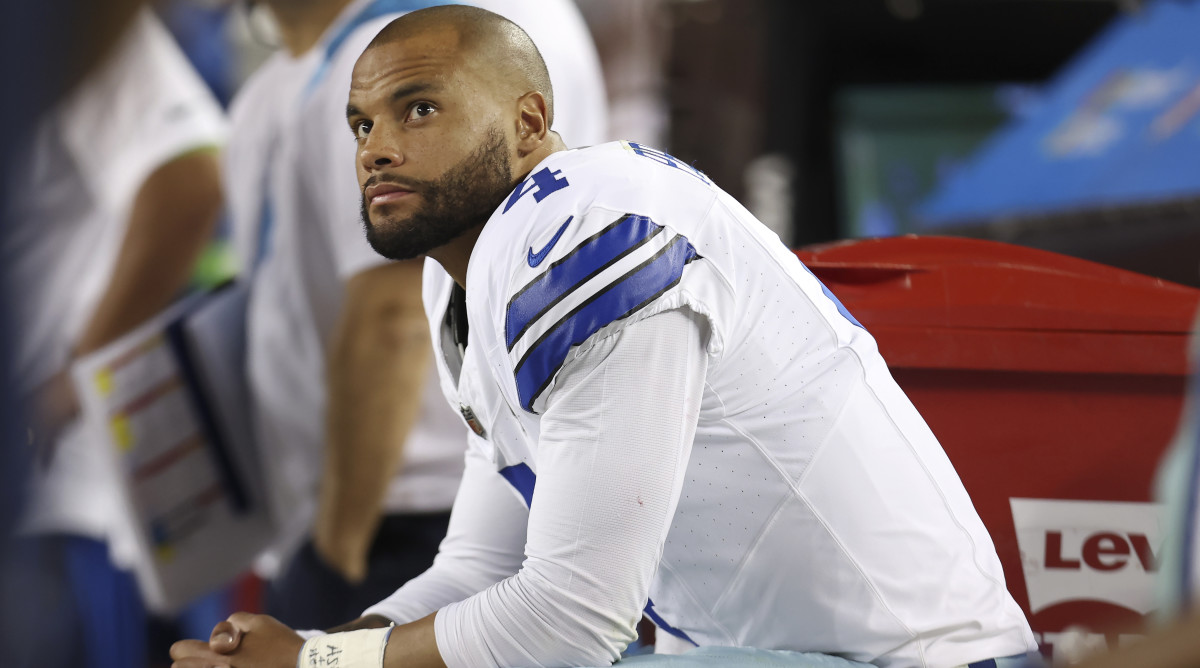 Cowboys quarterback Dak Prescott sits on the bench during a loss to 49ers