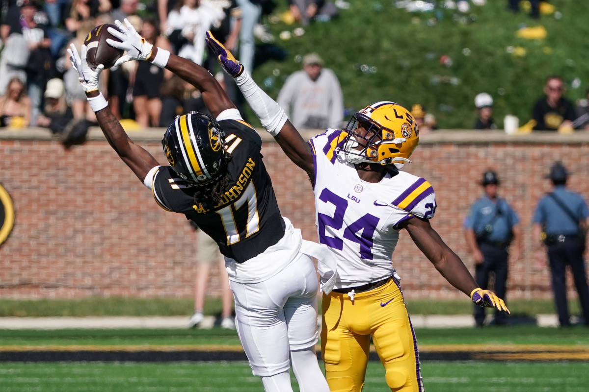 Oct 7, 2023; Columbia, Missouri, USA; Missouri Tigers wide receiver Marquis Johnson (17) catches a pass as LSU Tigers cornerback Zy Alexander (24) defends during the second half at Faurot Field at Memorial Stadium. Mandatory Credit: Denny Medley-USA TODAY Sports