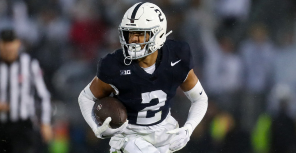 Penn State Nittany Lions running back Liam Clifford on a rushing attempt during a college football game in the Big Ten.