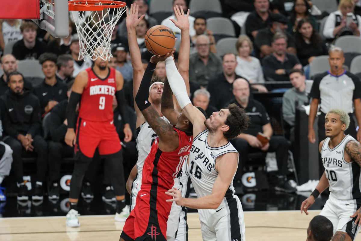 San Antonio Spurs forward Cedi Osman (16) blocks a shot by Houston Rockets forward Jabari Smith Jr. (10) in the first half at the Frost Bank Center.