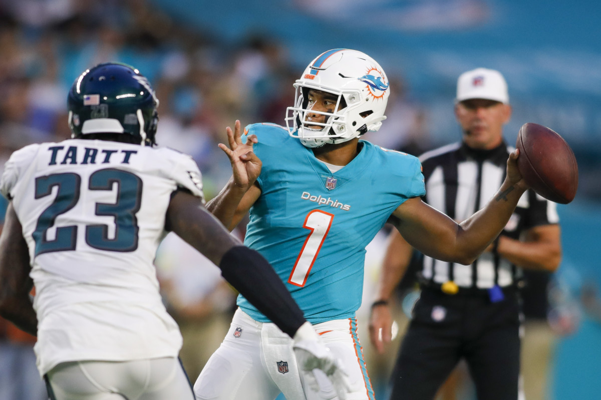 Miami Dolphins quarterback Tua Tagovailoa (1) passes the football as Philadelphia Eagles safety Jaquiski Tartt (23) defends during the first quarter at Hard Rock Stadium.
