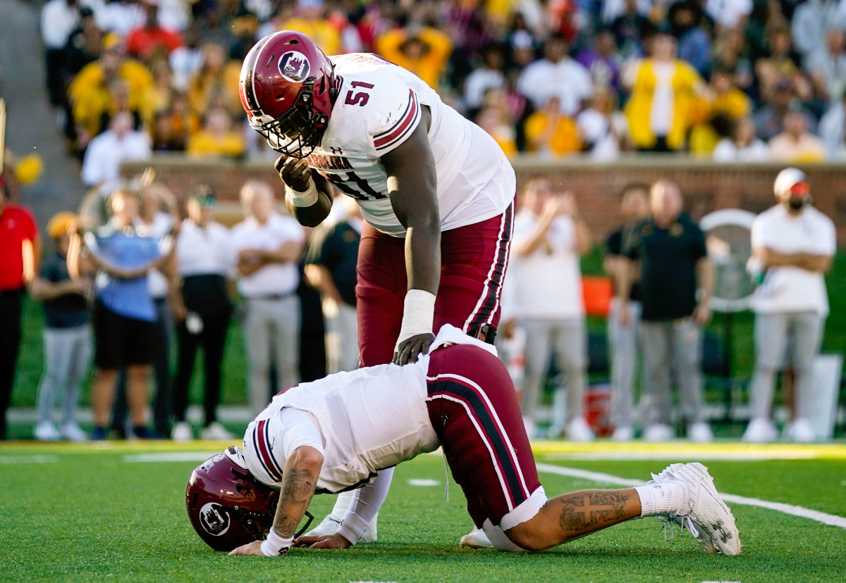 Tree Babalade checking on Spencer Rattler after he took a hit from a Missouri defender (21st Oct., 2023)