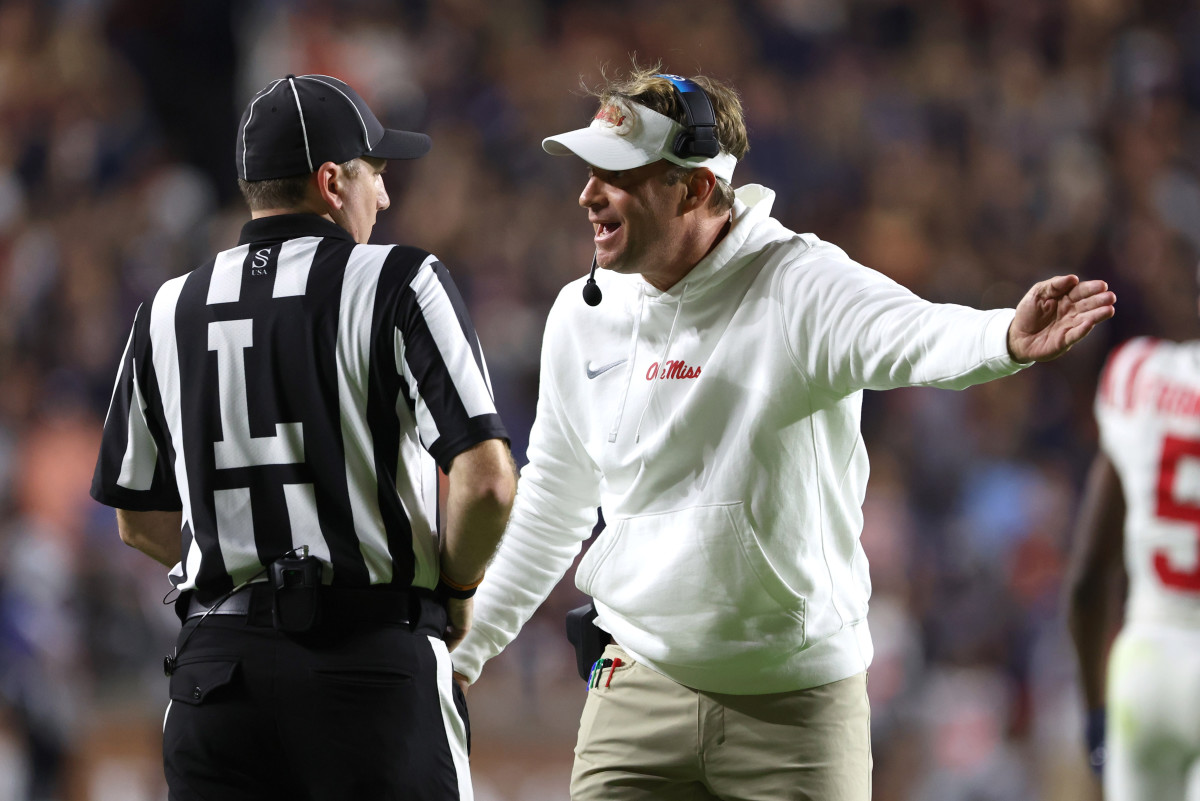 Oct 21, 2023; Auburn, Alabama, USA; Mississippi Rebels head coach Lane Kiffin talks to a game official during the second quarter against the Auburn Tigers at Jordan-Hare Stadium. Mandatory Credit: John Reed-USA TODAY Sports