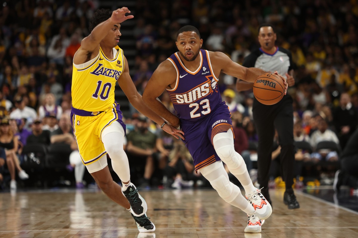 Phoenix Suns guard Eric Gordon (23) dribbles the ball against Los Angeles Lakers guard Max Christie (10) during the first quarter at Acrisure Arena.