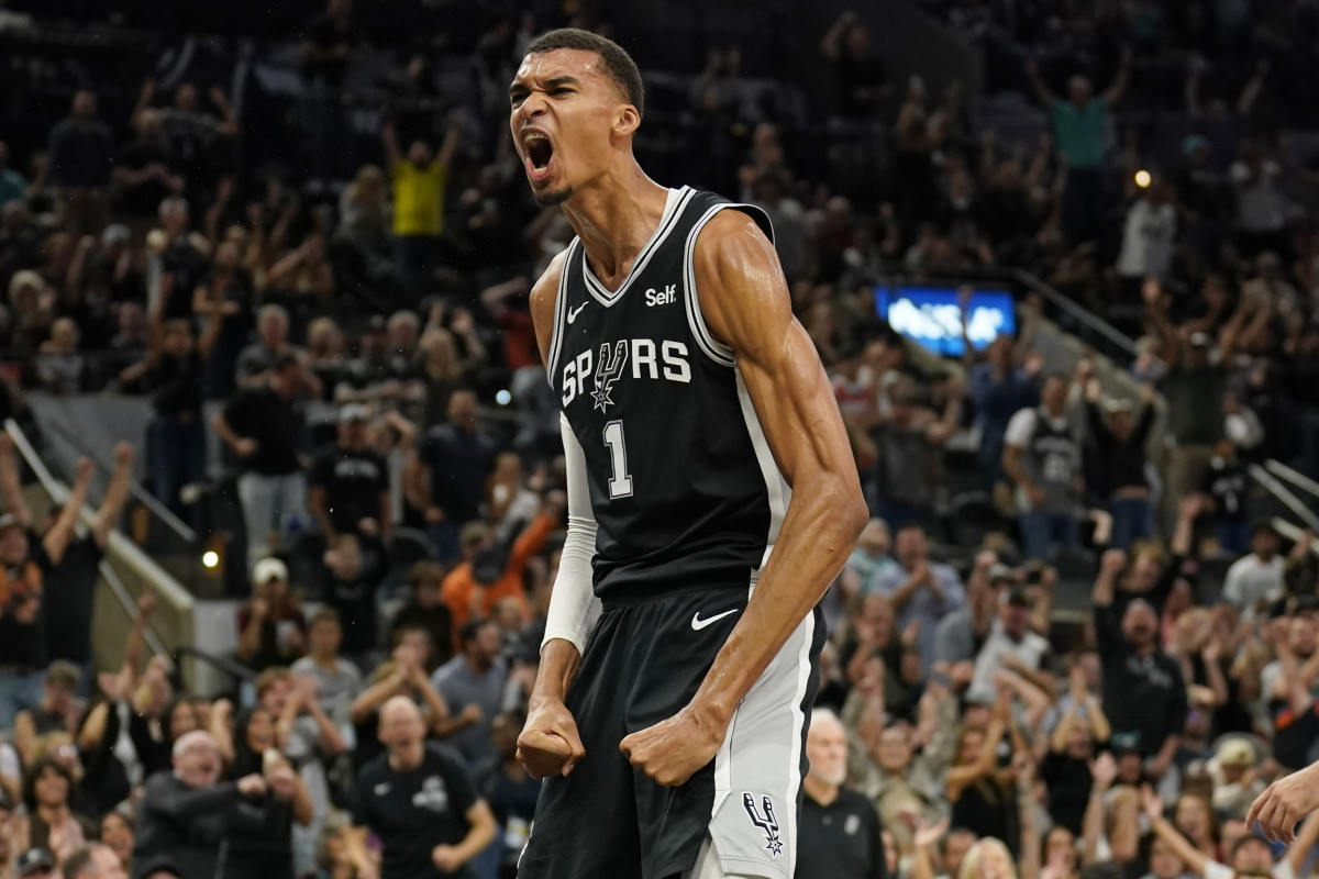 Oct 27, 2023; San Antonio, Texas, USA; San Antonio Spurs forward Victor Wembanyama (1) reacts after dunking during the second half against the Houston Rockets at Frost Bank Center.
