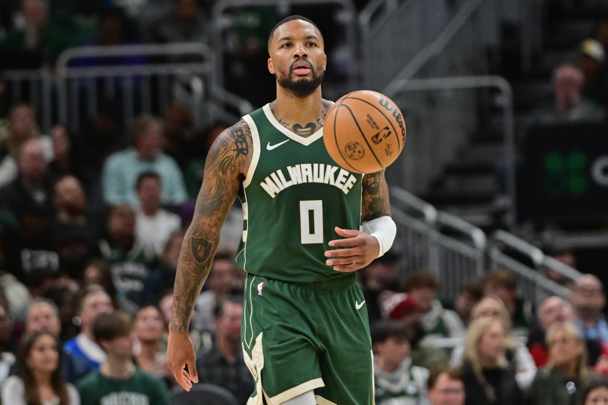 Milwaukee Bucks guard Damian Lillard (0) brings the ball down court