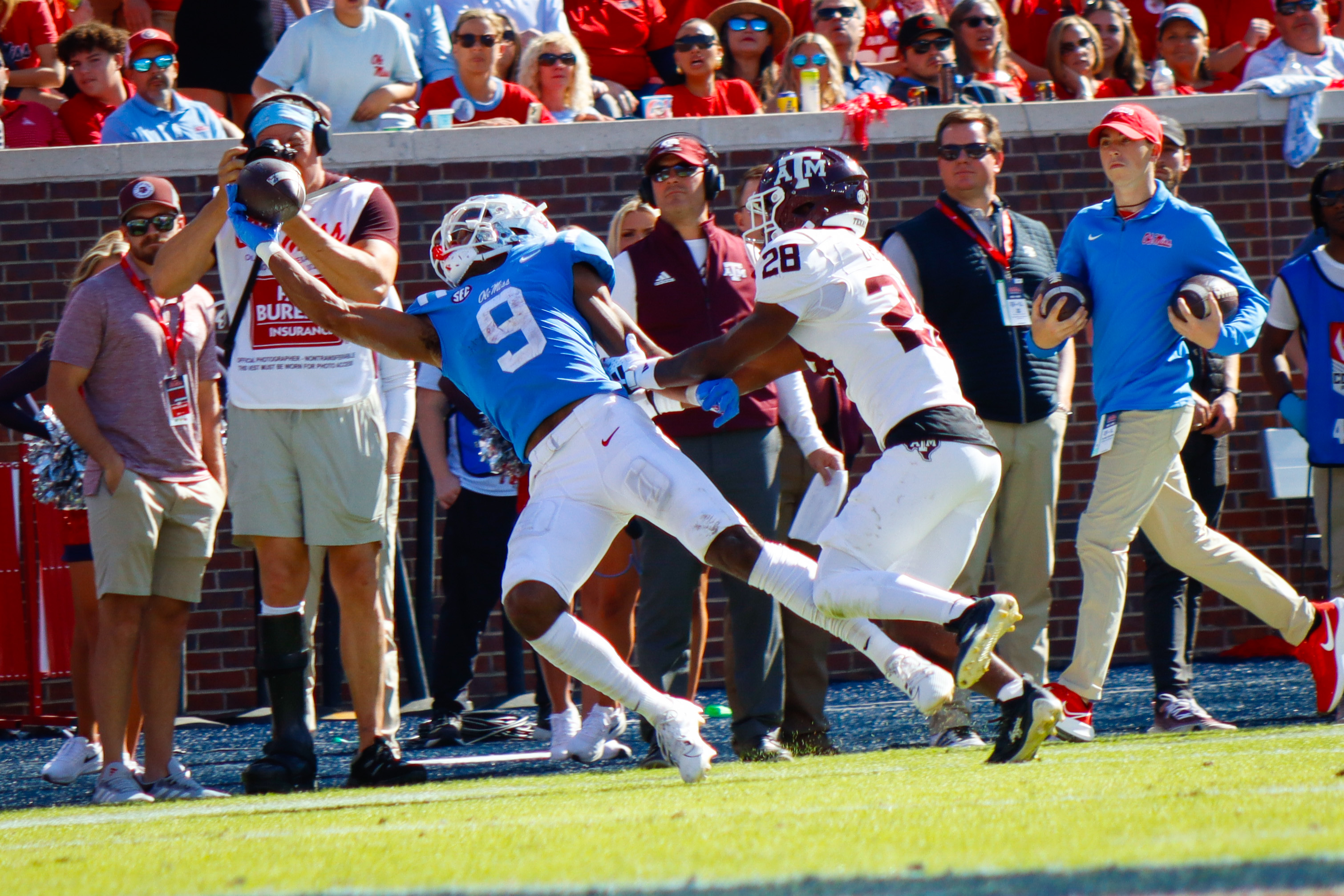 Ole Miss Rebels Tre Harris makes diving grab against Texas A&M defensive back Josh DeBerry at Vaught-Hemingway Stadium in Oxford. 