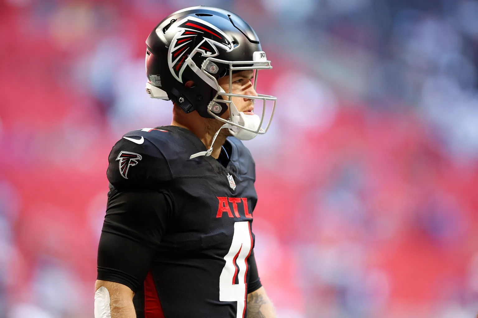 ATLANTA, GEORGIA - NOVEMBER 05: Taylor Heinicke #4 of the Atlanta Falcons looks on before the game against the Minnesota Vikings at Mercedes-Benz Stadium on November 05, 2023 in Atlanta, Georgia.
