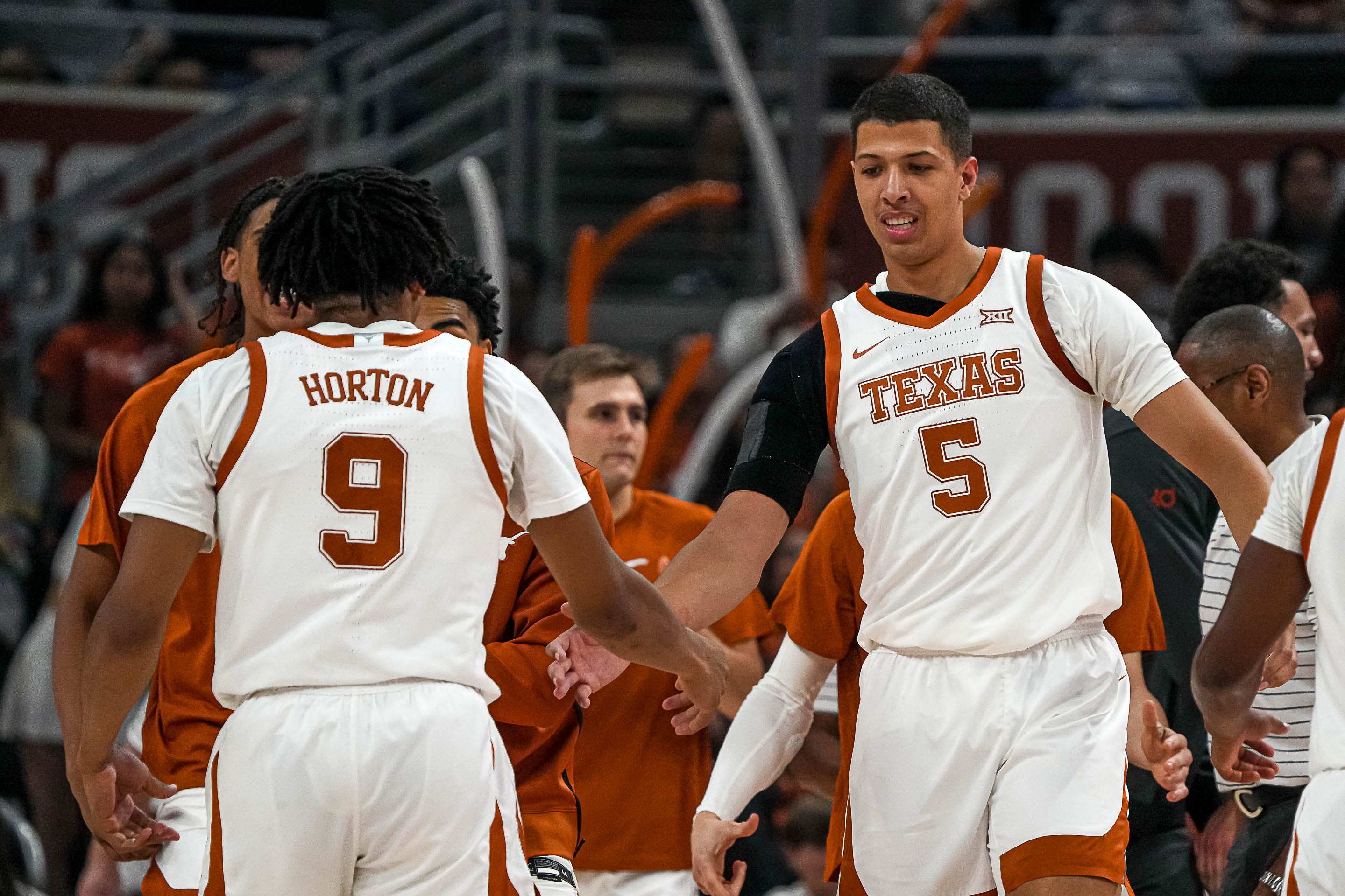 Texas Longhorns forward Kadin Shedrick (5) celebrates with guard Ithiel Horton (9) during a timeout in the men s basketball game against the University of the Incarnate Word at the Moody Center