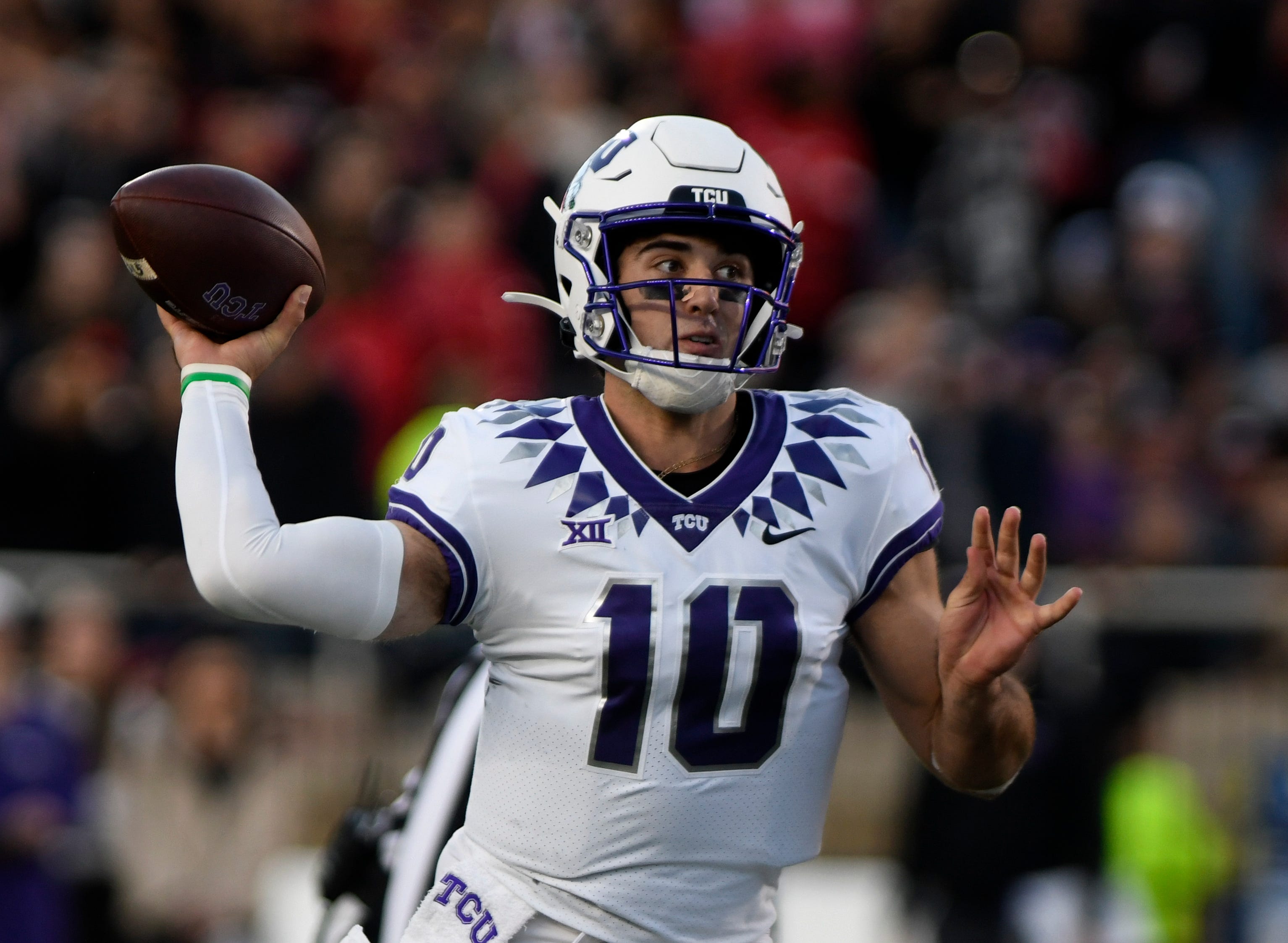 TCU's quarterback Josh Hoover (10) prepares to throw the ball against Texas Tech in a Big 12 football game, Thursday, Nov. 2, 2023, at Jones AT&T Stadium. 