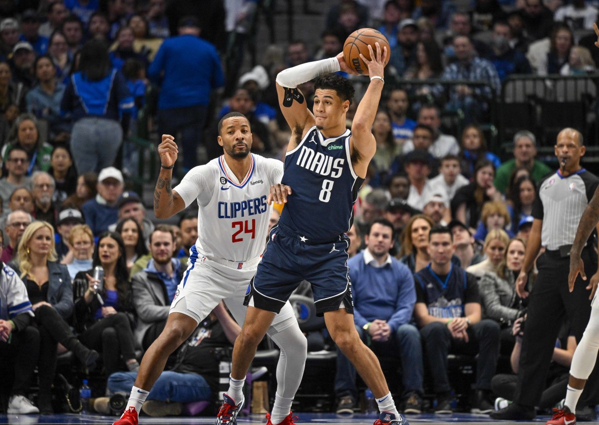 Mavs' Josh Green passes out of the post against Clippers' Normal Powell.