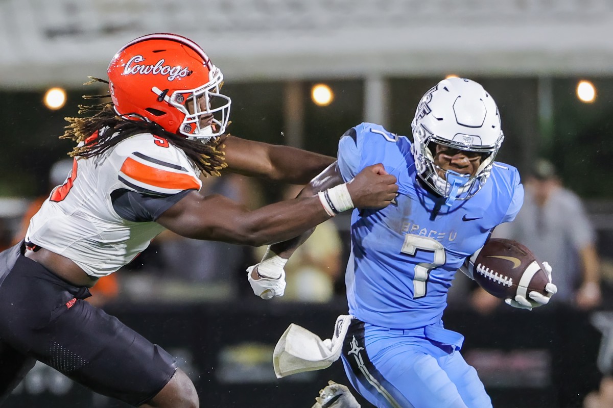 Nov 11, 2023; Orlando, Florida, USA; UCF Knights running back RJ Harvey (7) runs the ball against Oklahoma State Cowboys safety Trey Rucker (9) during the second half at FBC Mortgage Stadium.