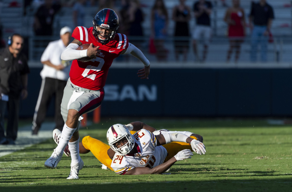 Oct 6, 2018; Oxford, MS, USA; Louisiana Monroe Warhawks defensive back Jabari Johnson (24) can only watch after Mississippi Rebels quarterback Matt Corral (2) escapes his grasp and runs for a 61-yard touchdown during the second half at Vaught-Hemingway Stadium. Mandatory Credit: Vasha Hunt-USA TODAY Sports
