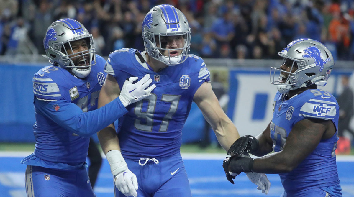 Lions defenders Jalen Reeves-Maybin, Aidan Hutchinson and Charles Harris celebrate a safety against the Bears
