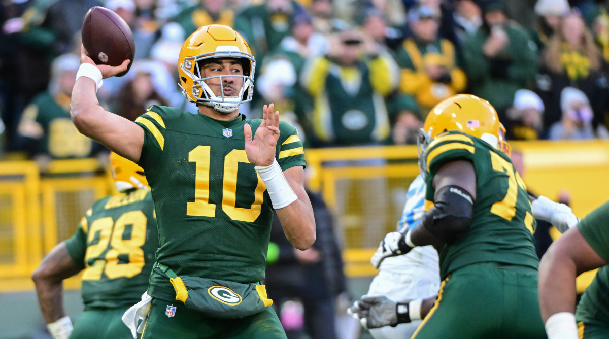 Jordan Love throws the football with one hand