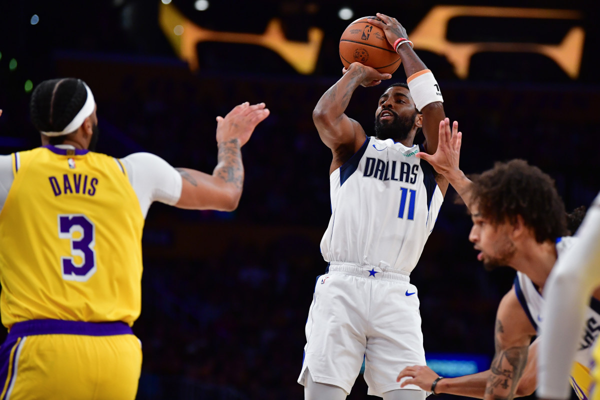 Dallas Mavericks star Kyrie Irving shoots over Los Angeles Lakers' Anthony Davis.