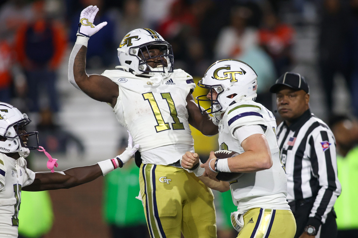 Nov 18, 2023; Atlanta, Georgia, USA; Georgia Tech Yellow Jackets quarterback Haynes King (10) celebrates after a touchdown with running back Jamal Haynes (11) against the Syracuse Orange in the second half at Bobby Dodd Stadium at Hyundai Field. Mandatory Credit: Brett Davis-USA TODAY Sports  
