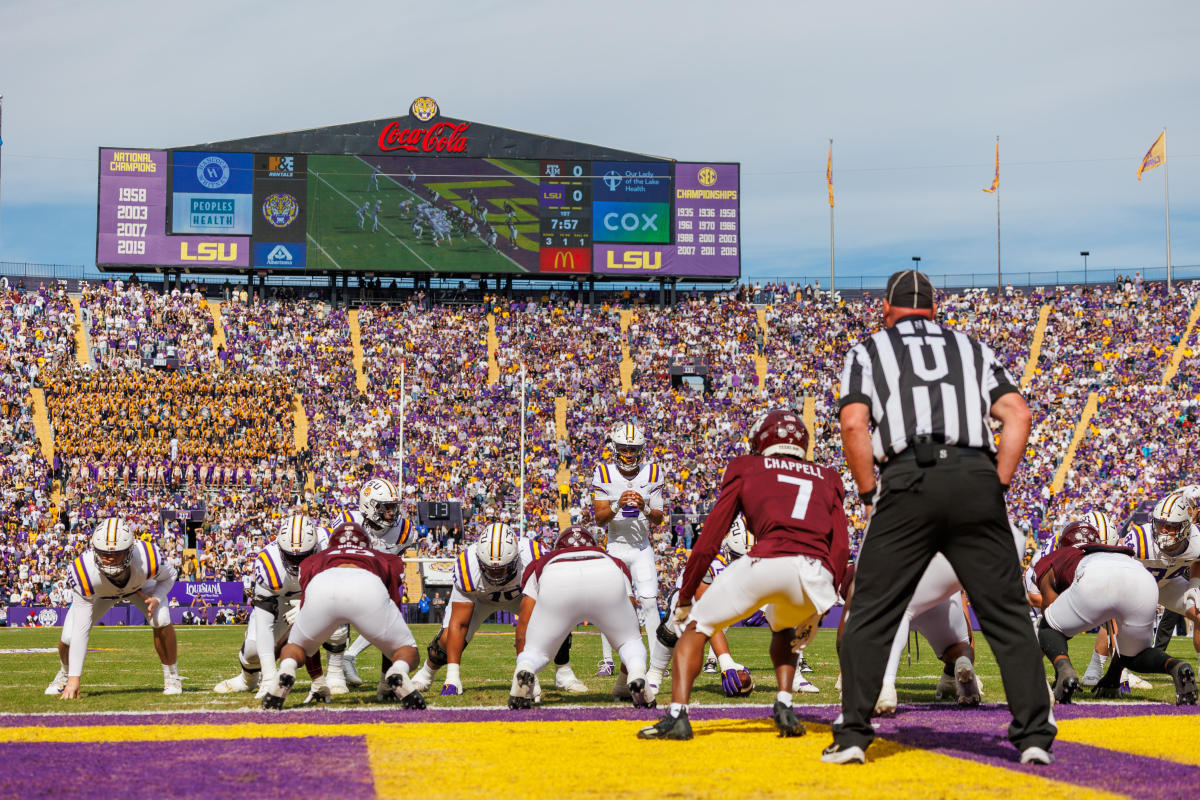 Nov 25, 2023; Baton Rouge, Louisiana, USA; LSU Tigers quarterback Jayden Daniels (5) calls for the ball against Texas A&M Aggies defensive back Tyreek Chappell (7) during the first half at Tiger Stadium.