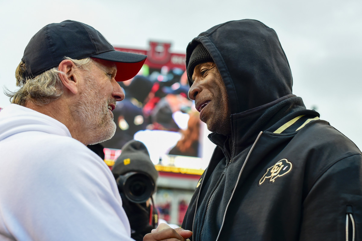 Nov 25, 2023; Salt Lake City, Utah, USA; Colorado Buffaloes head coach Deion 'Coach Prime' Sanders congratulates Utah Utes head coach Kyle Whittingham after the Utah Utes victory over the Colorado Buffaloes at Rice-Eccles Stadium. Mandatory Credit: Christopher Creveling-USA TODAY Sports