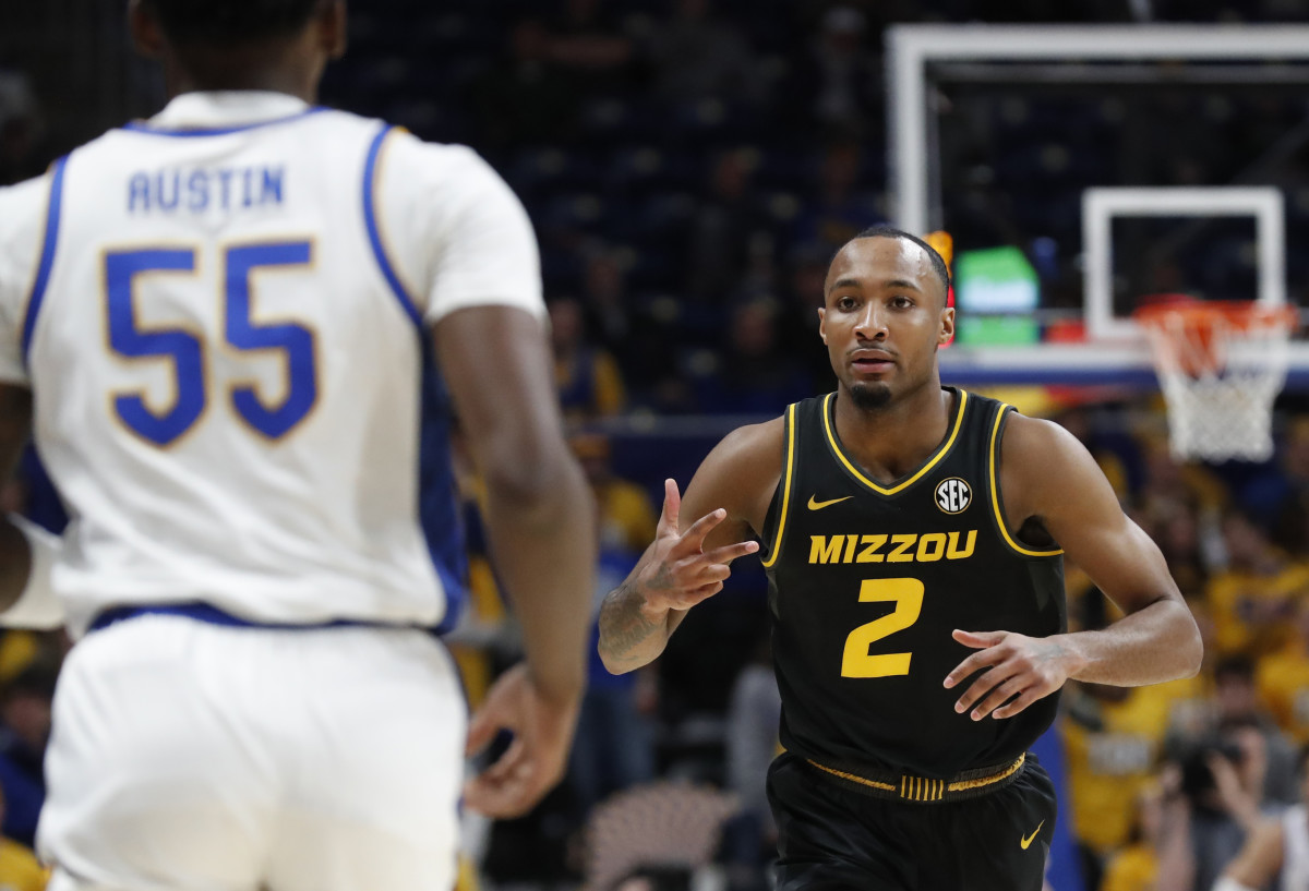 Nov 28, 2023; Pittsburgh, Pennsylvania, USA; Missouri Tigers guard Tamar Bates (2) reacts to Pittsburgh Panthers forward Zack Austin (55) after Bates made a three point basket during the first half at the Petersen Events Center