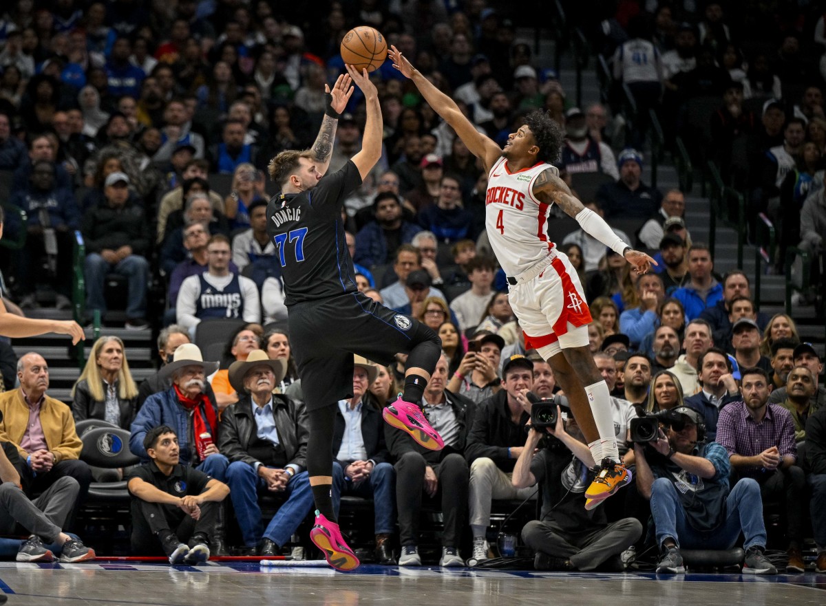 Dallas Mavericks guard Luka Doncic (77) shoots over Houston Rockets guard Jalen Green (4) during the second half at the American Airlines Center.