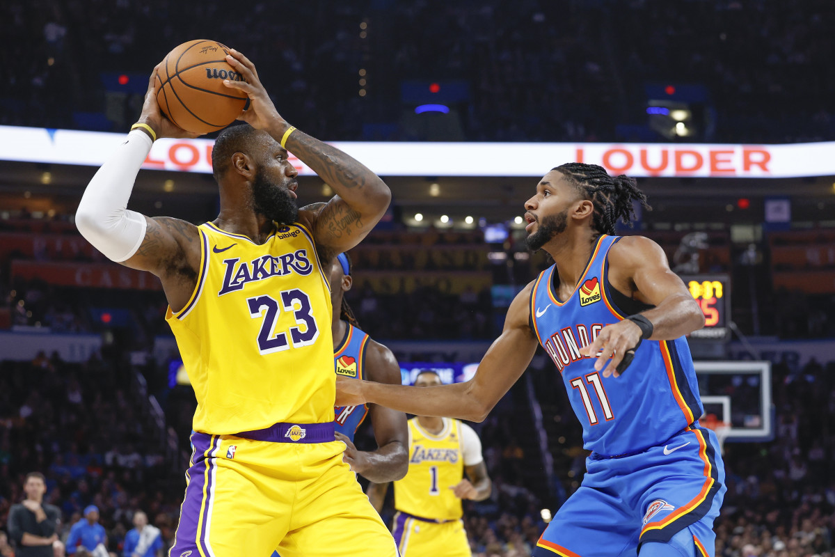 Nov 30, 2023; Oklahoma City, Oklahoma, USA; Oklahoma City Thunder guard Isaiah Joe (11) defends Los Angeles Lakers forward LeBron James (23) during the second quarter at Paycom Center.