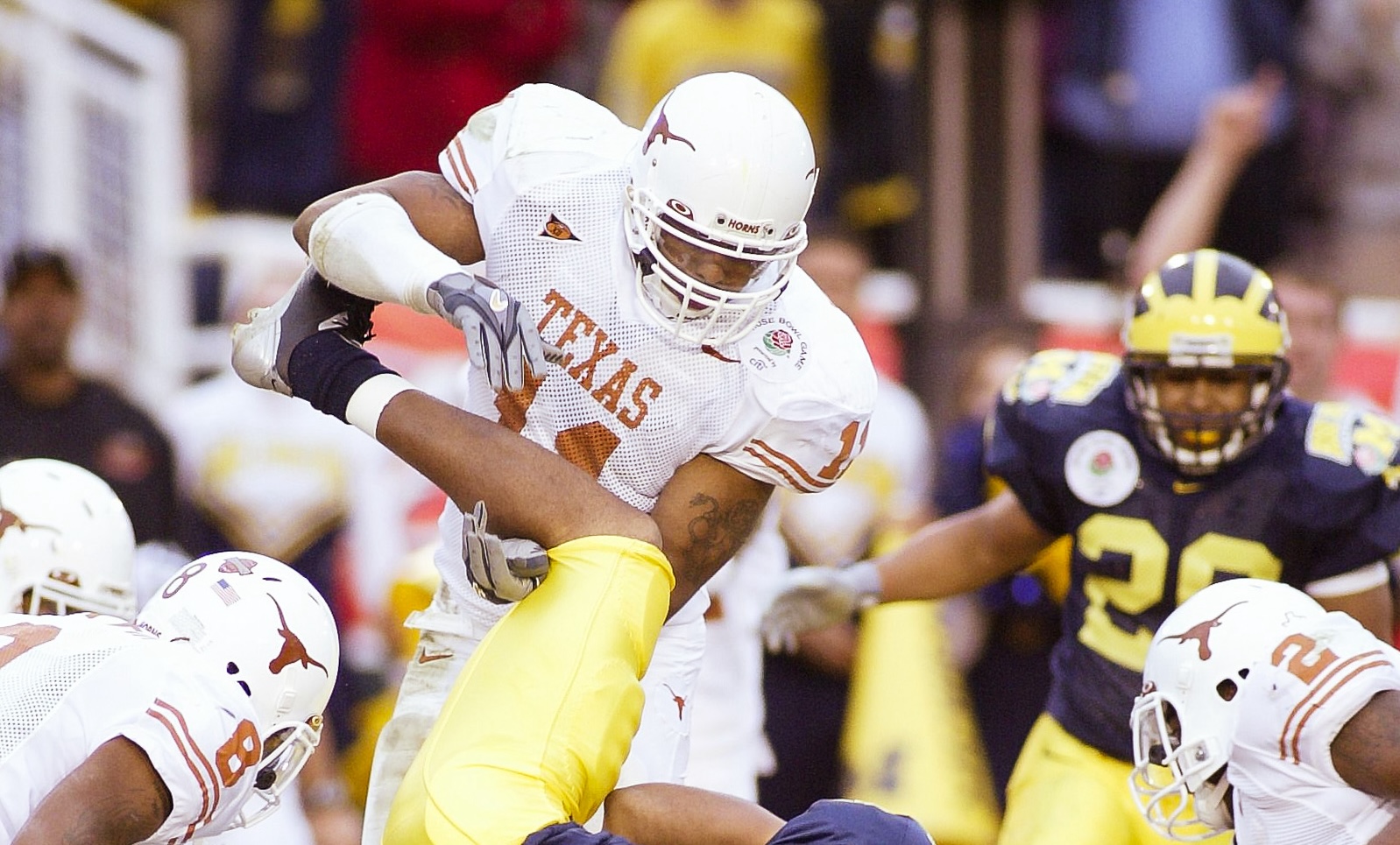 Jan 1, 2005; Pasadena, CA, USA: FILE PHOTO; Michigan Wolverines wide receiver Jermaine Gonzales (18) in action against Texas Longhorns cornerback Cedric Griffin (8) and linebacker Derrick Johnson (11) during the 2005 Rose Bowl at the Rose Bowl. The Longhorns defeated the Wolverines 38-37.