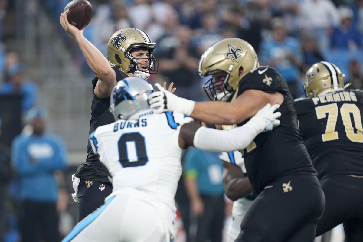New Orleans Saints quarterback Derek Carr (4) is pressured by Carolina Panthers linebacker Brian Burns (0). Mandatory Credit: Jim Dedmon-USA TODAY