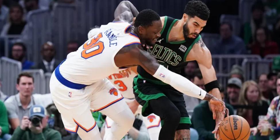 Julius Randle (30) has been forced into 42 road games, including an extra date with Jayson Tatum and the Celtics
