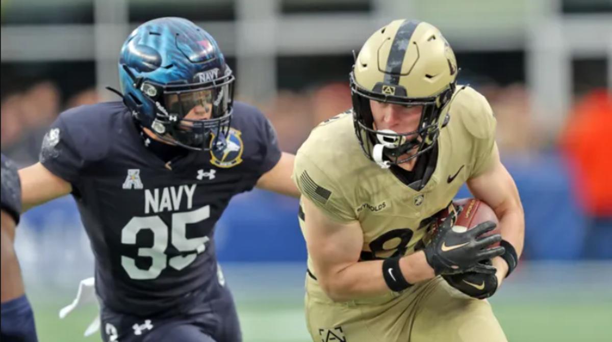 Army's Casey Reynolds (R) flees from Navy's Kush'i Abraham during Saturday's game
