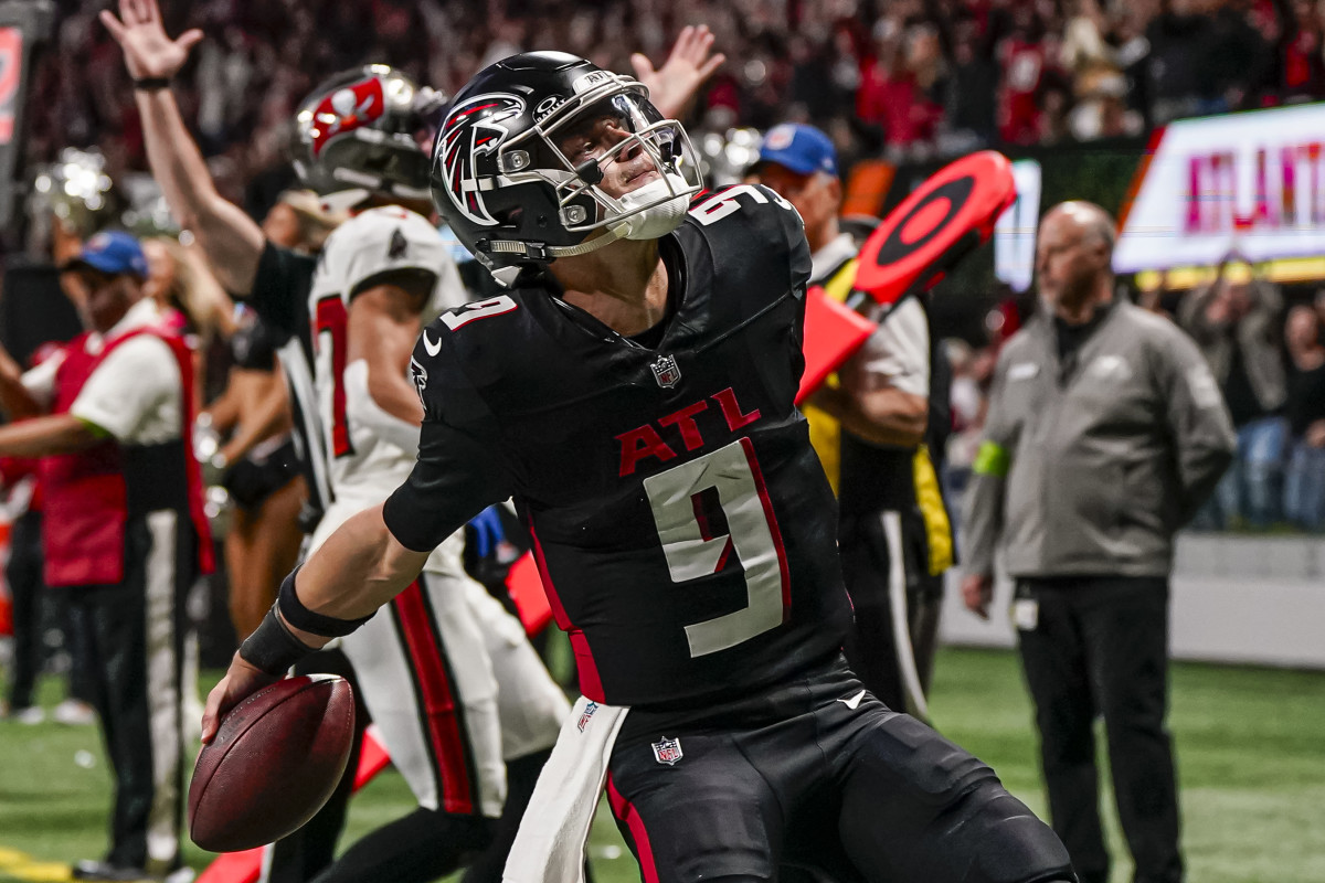 Dec 10, 2023; Atlanta, Georgia, USA; Atlanta Falcons quarterback Desmond Ridder (9) reacts after scoring a touchdown against the Tampa Bay Buccaneers during the second half at Mercedes-Benz Stadium. 