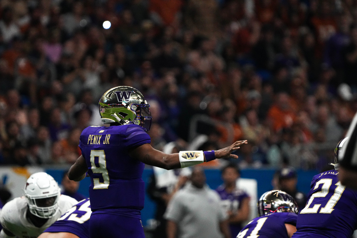 Washington Huskies quarterback Michael Penix Jr. (9) lines up the offense for a snap against Texas during the Alamo Bowl at the Alamodome, Thursday, Dec. 29, 2022 in San Antonio