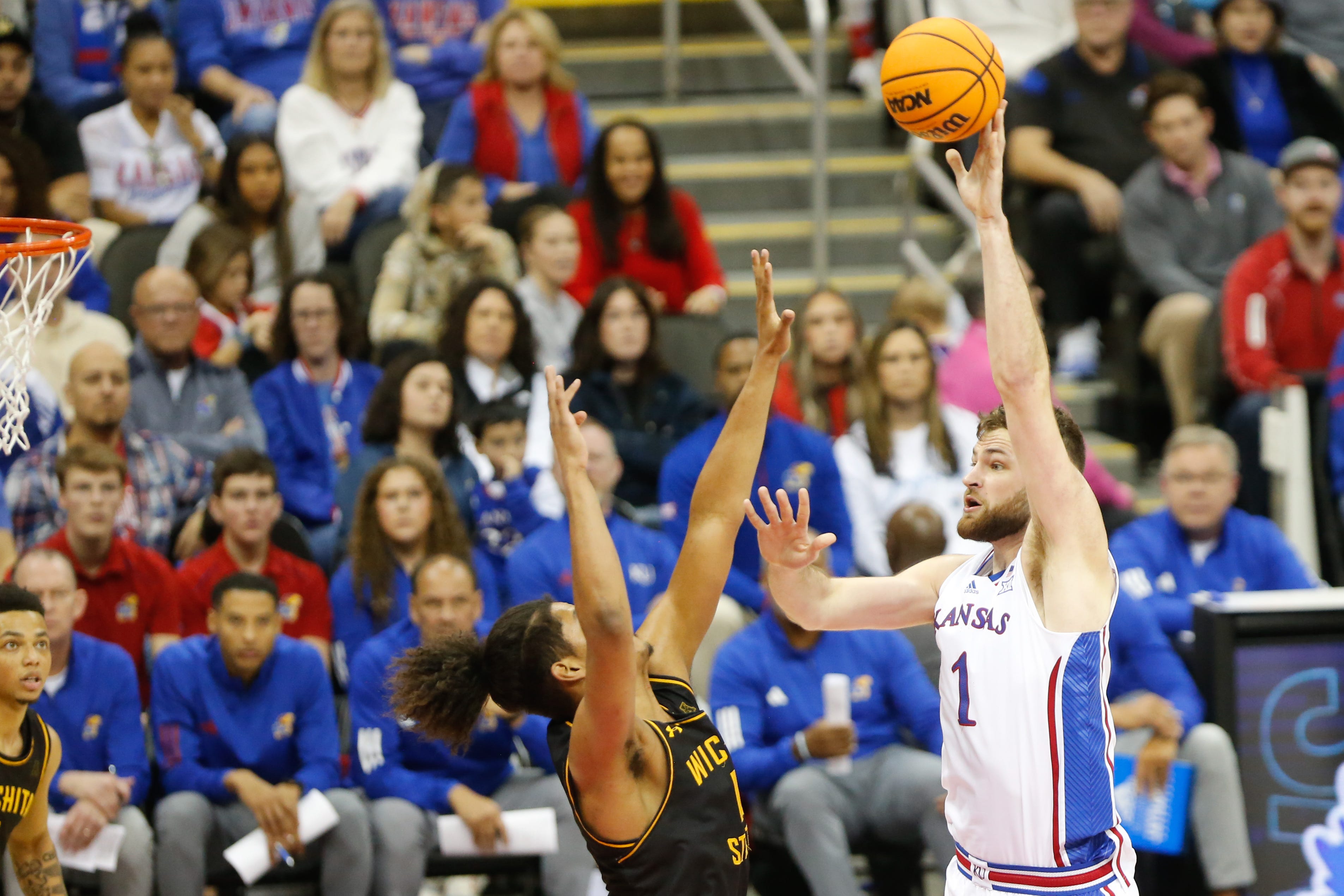 Kansas senior center Hunter Dickinson (1) shoots for two against Wichita State during the second half of Saturday's game inside T-Mobile Center in Kansas City.