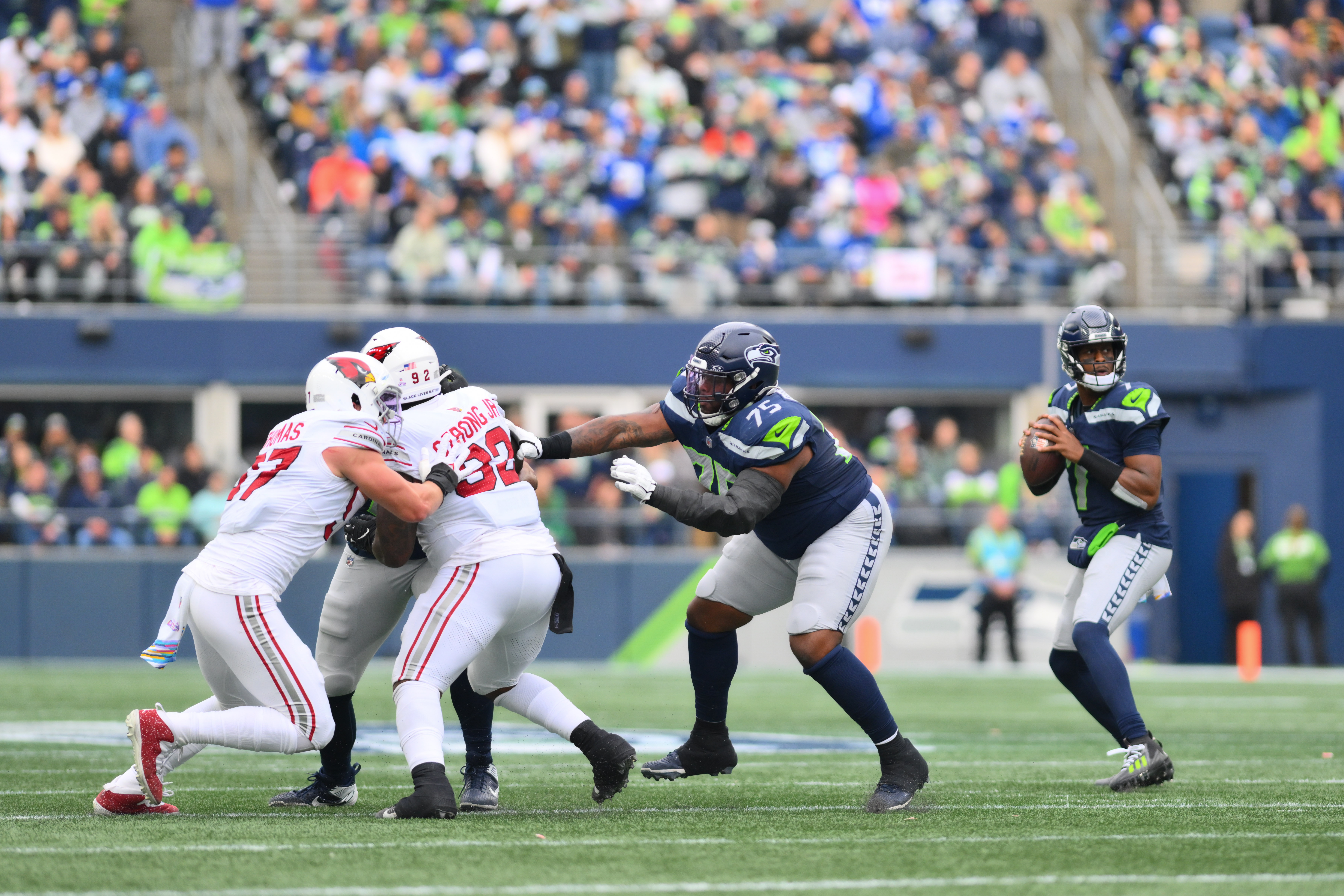 Oct 22, 2023; Seattle, Washington, USA; Seattle Seahawks quarterback Geno Smith (7) looks to pass the ball against the Arizona Cardinals during the first half at Lumen Field. 