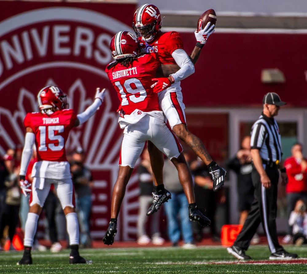Indiana's Josh Sanguinetti (19), Kobee Minor (5) and Nic Toomer (15) celebrate a turnover during the second half of the Indiana versus Wisconsin football game at Memorial Stadium on Saturday, Nov. 4, 2023.