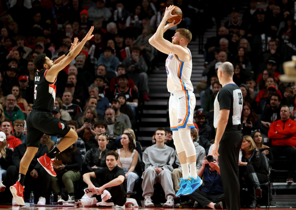 Nov 19, 2023; Portland, Oregon, USA; Oklahoma City Thunder forward Davis Bertans (9) shoots over Portland Trail Blazers guard Skylar Mays (5) in the first half at Moda Center.