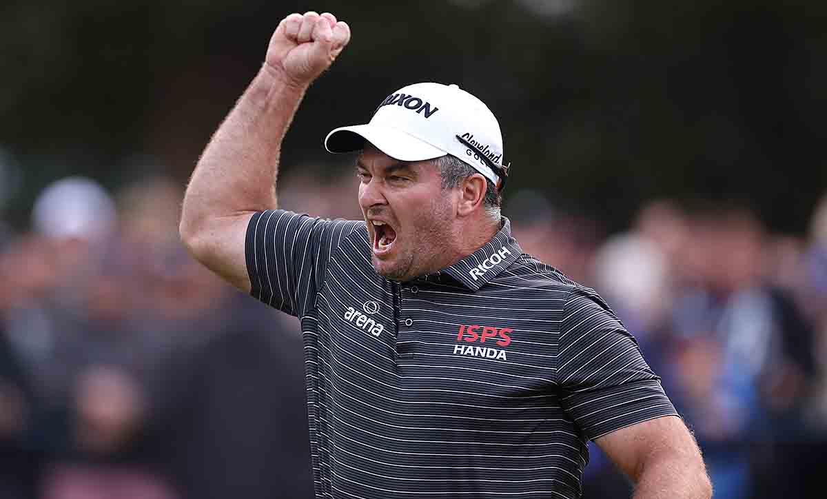 Ryan Fox of New Zealand celebrates as he holes the winning putt on the 18th green at the 2023 BMW PGA Championship.