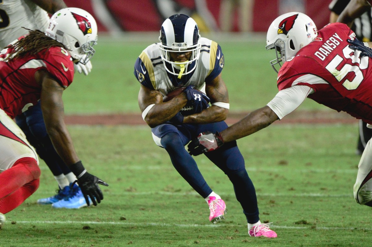 Dec 3, 2017; Glendale, AZ, USA; Los Angeles Rams wide receiver Tavon Austin (11) runs the ball as Arizona Cardinals linebacker Chandler Jones (55) defends during the second half at University of Phoenix Stadium.