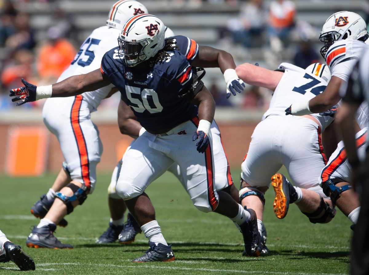 Auburn Tigers defensive lineman Marcus Harris (50) breaks through the line during Spring Practice.