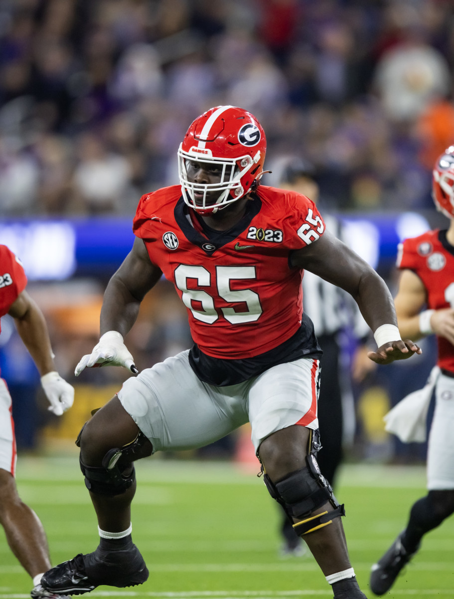 Jan 9, 2023; Inglewood, CA, USA; Georgia Bulldogs offensive lineman Amarius Mims (65) against the TCU Horned Frogs during the CFP national championship game at SoFi Stadium. Mandatory Credit: Mark J. Rebilas-USA TODAY Sports